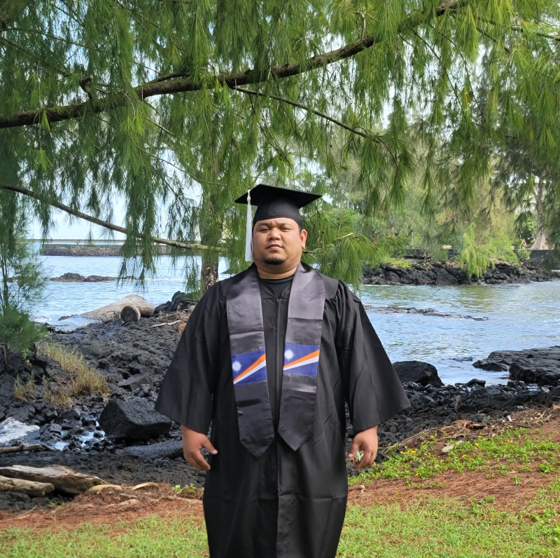 This is another picture of me with my graduation attire. I chose this spot to take picture to capture the beautiful trees.