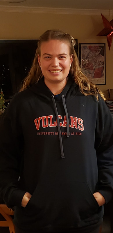 Alexandria Cain standing in her UH sweatshirt.