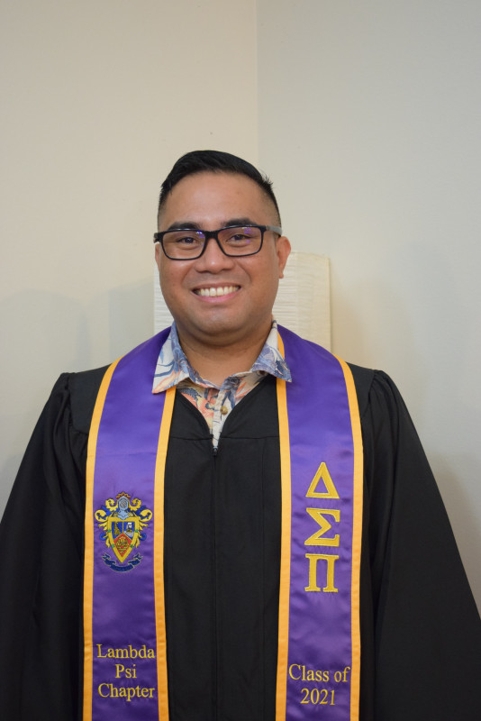 me front-facing with my gown and Dsp sash