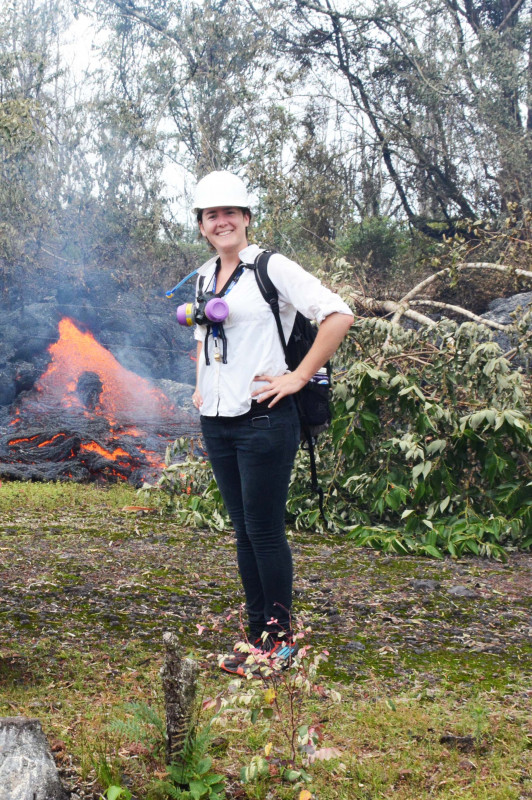 Michelle Mazzetti standing in front of an active Pahoehoe Flow during the 2015 Pahoa Eruption