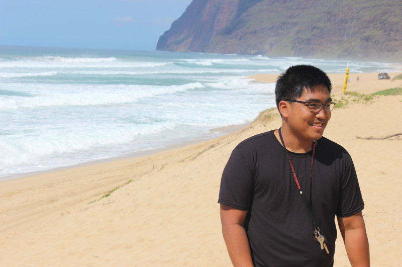 Candid photo taken at a beach with mountains in the background