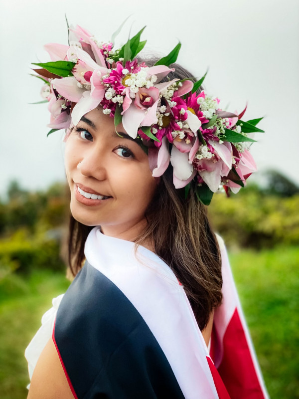 Graduate, Shantel Kalola Tamiko Rita, with Lei Po’o and Master’s Hood