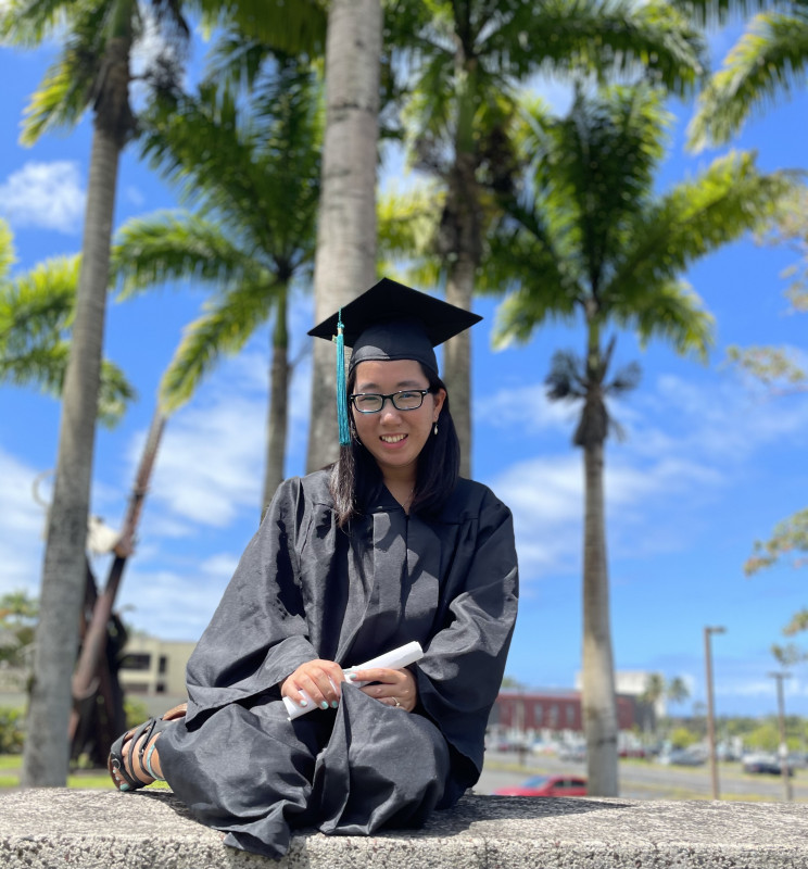 A photo of me with a graduation cap and gown.