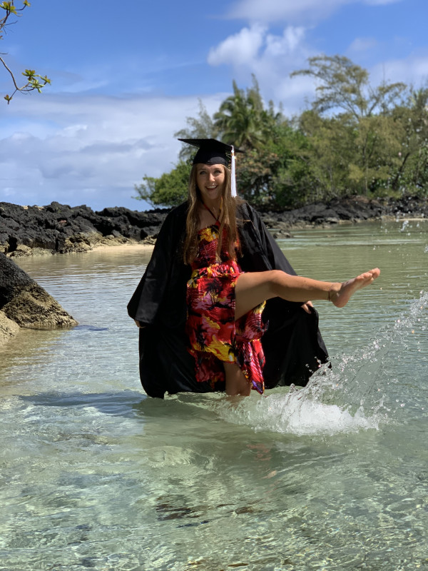 Having fun in the water while celebrating in my cap and gown.