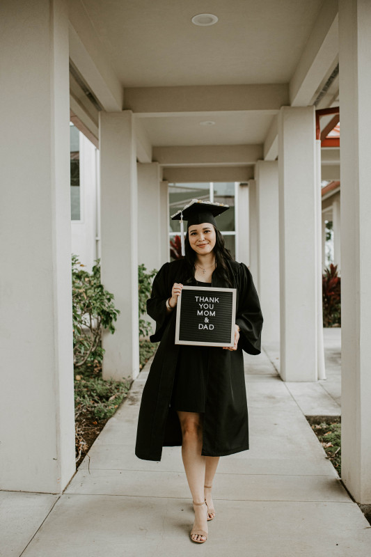 This image is of myself holding a sign to thank mom and dad