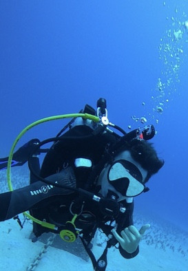 Picture of myself SCUBA diving over a large sand patch