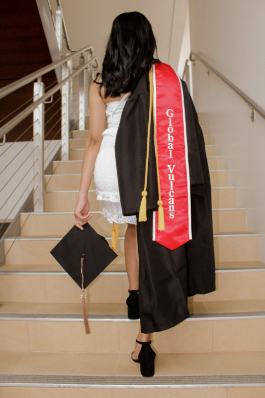 Shiela walking up the stairs to indicate achieving another success in life.
