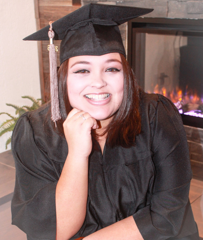 The photo is self portrait in my cap and gown in front of a fireplace.