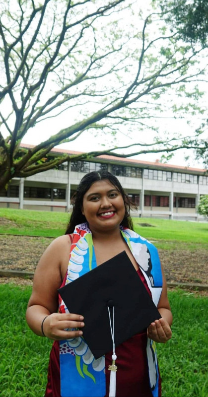 Photo of graduate on campus