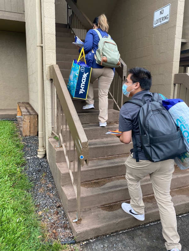 Rod Neil Burbano and one of his classmates doing an outreach activity at one of the affordable housing in Hilo.