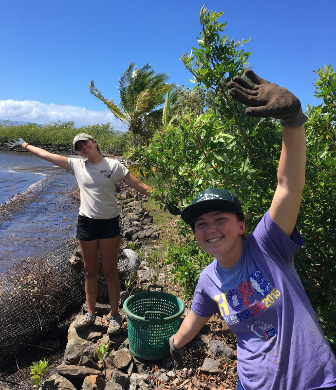 Photo from Break Thru Adventures 2019 in Molokai moving rocks and removing invasive plants