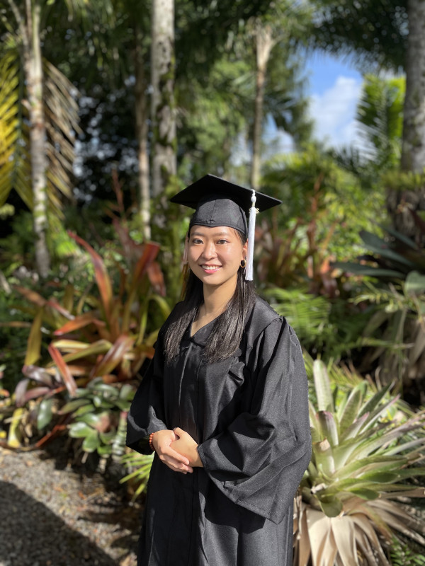 Lisa Hiraishi with graduation gown