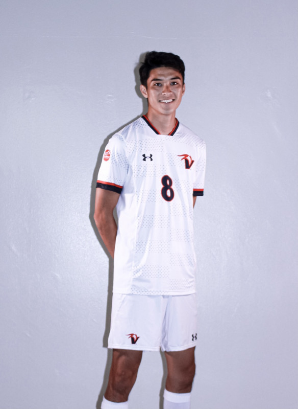 This picture contains me posing for media day for the men's Soccer team