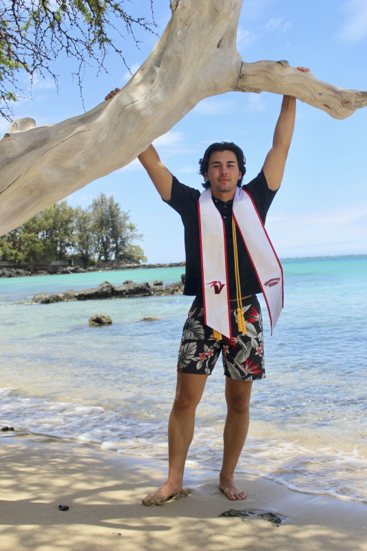 Here is Anthony at the beach, hanging on a tree branch for his graduation pictures.