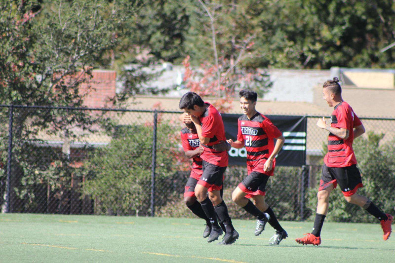This picture contains my teammates and I celebrating a goal together against Dominican university in California.