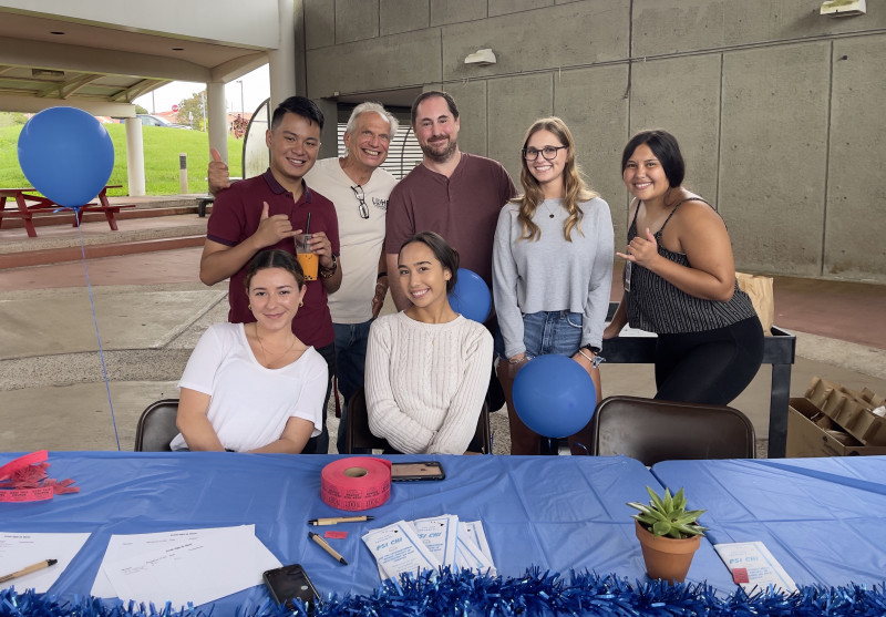 This is a group photo of the 2022-2023 officers and advisors of Psi Chi International Honors Society UH Hilo Chapter. Photo taken at their first on-campus event, "Psi Chi and All You Can Try". I am seated in the front, center.