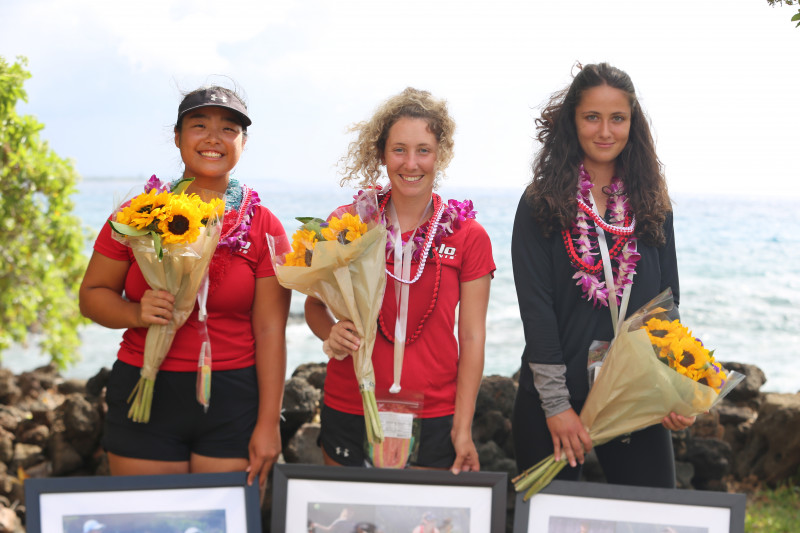 2022 UH Hilo Women's Tennis Team's Seniors, each holding a bouquet and framed poster