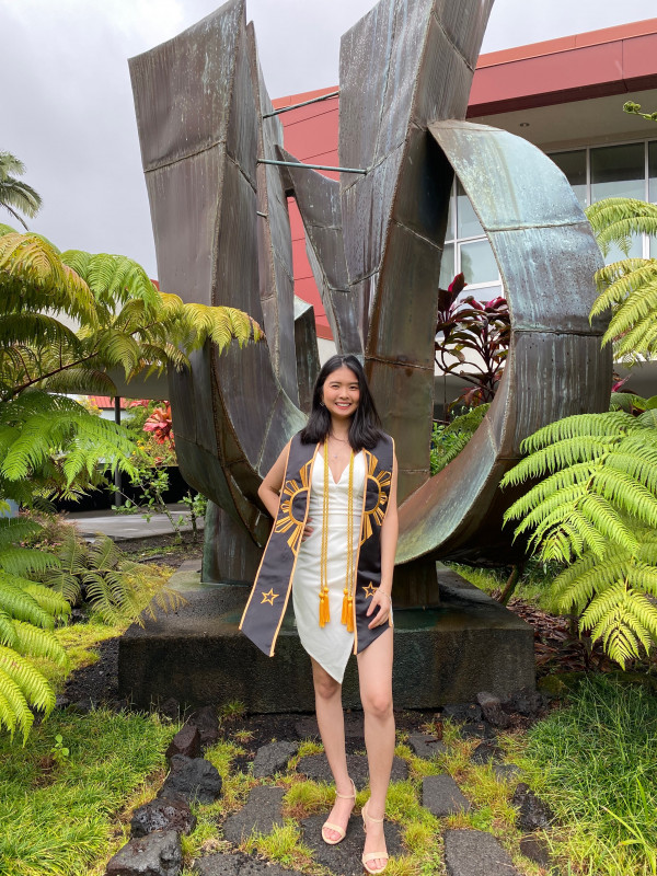 The photo is a full-length photo with my graduation dress. The photo is taken at UH Hilo.