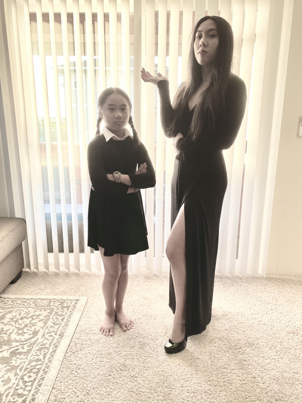My daughter, Jaylabel, and I dressed as Wednesday and Morticia from The Addams