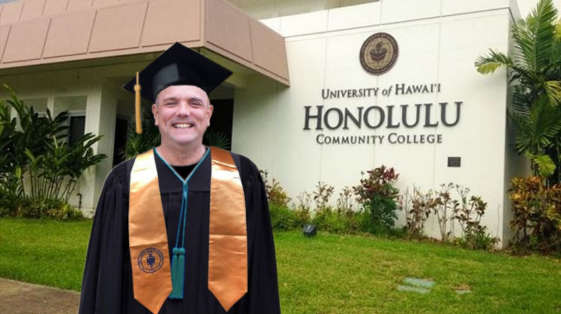 Me wearing cap & gown with teal gown tassels, and Phi Theta Kappa gold cap tassel & stole