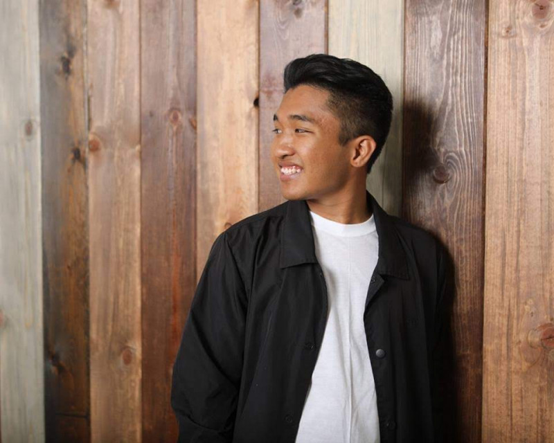 This is an image of myself leaning against the wall, and featuring my side profile.