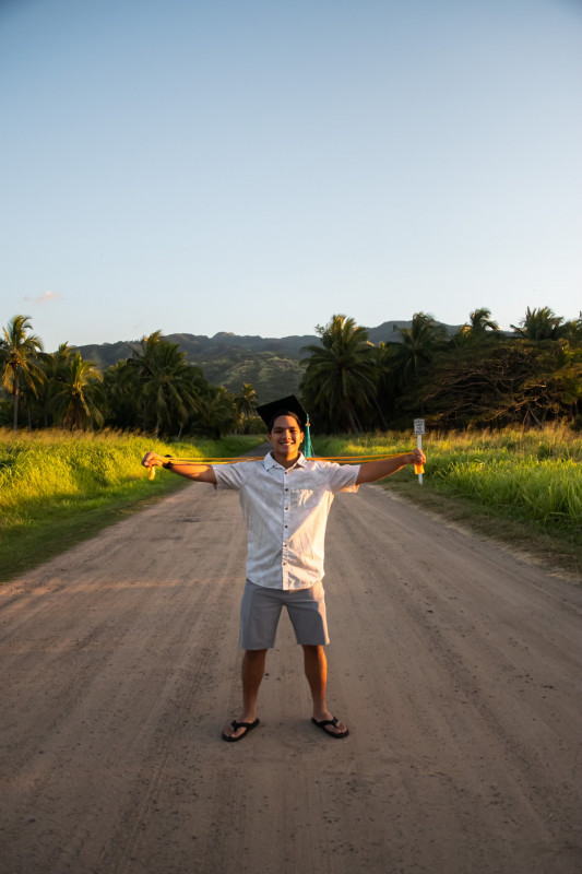 Picture of me in Palm Tree Forest with a beautiful view of Mt. Ka'ala in the background