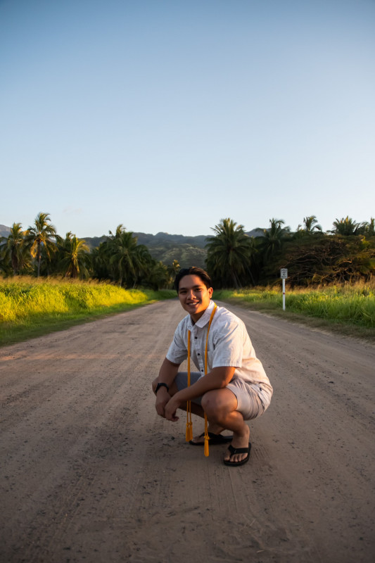 Picture of me in Palm Tree Forest with a beautiful view of Mt. Ka'ala in the background