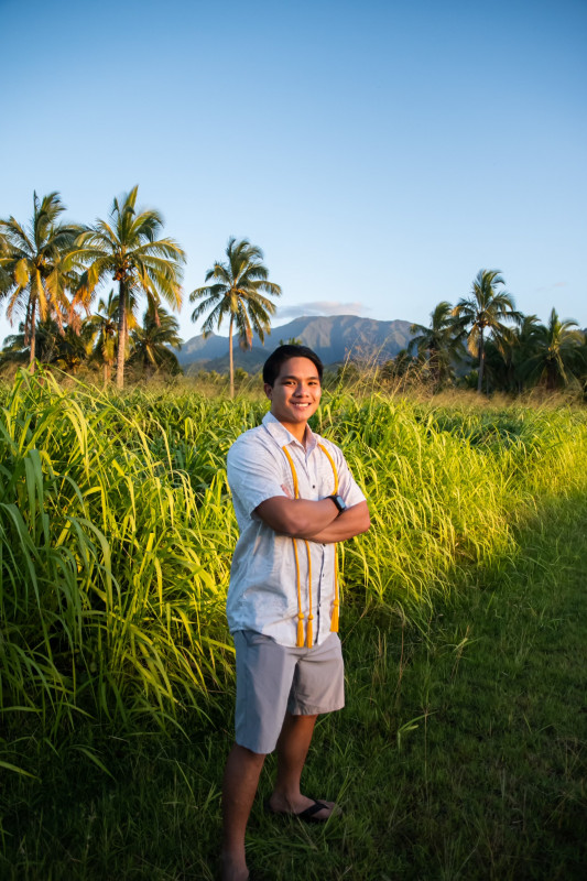 Picture of me in Palm Tree Forest with a beautiful view of Mt. Ka'ala in the background