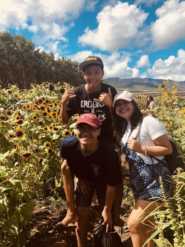 A picture with my siblings at the Aloun Farm Sunflower Fields