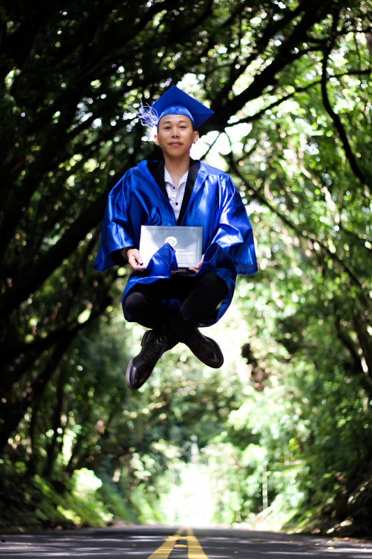 Jiro floating in the air with his diploma.