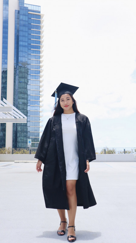 My ever supportive best friend Jas took these pics for me. I'm smiling at the camera with my cap and gown.