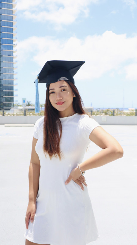 A close up picture of me smiling and wearing my cap.