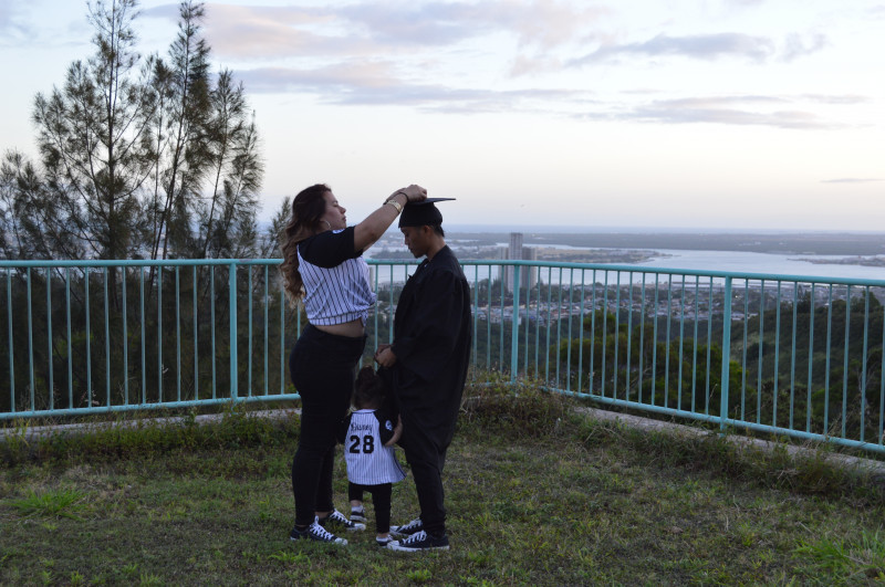 My girlfriend fixing my cap.