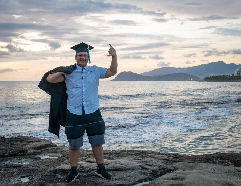 Wearing my casual outfit with my gown over my shoulder.