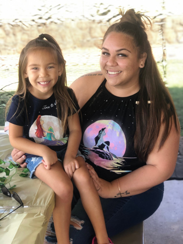 A photo of a time my daughter and I was matching in our little mermaid shirts.