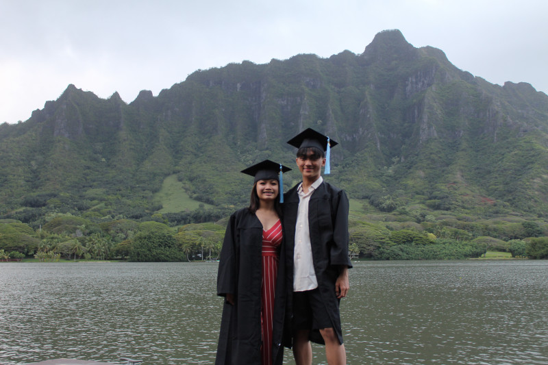 My friend and I took a photo together smiling. With the mountain background.