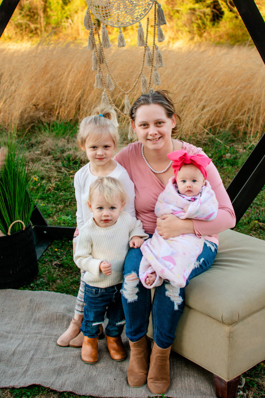 Graduate, Kasandra Comer with her three daughters.