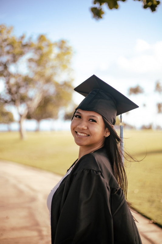 Picture smiling with cap, gown, and tassel on