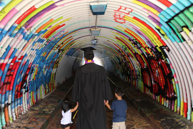 Myself walking with my children hand in hand through the tunnel.