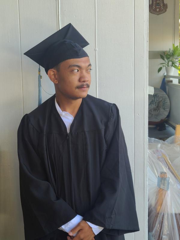 It's a picture of myself in my cap and gown outfit looking into the distance.