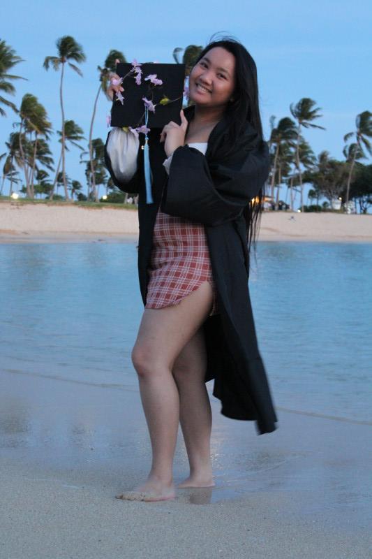 At the beach wearing my cap and gown