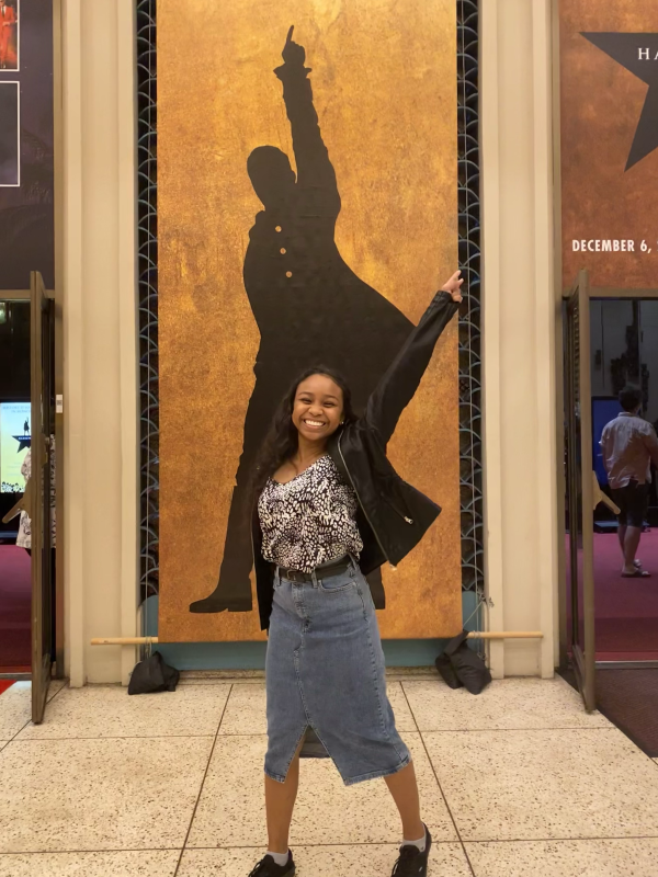 Standing in front of Hamilton sign before watching the show