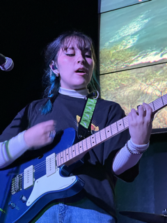 Makana playing guitar at her band's most recent gig