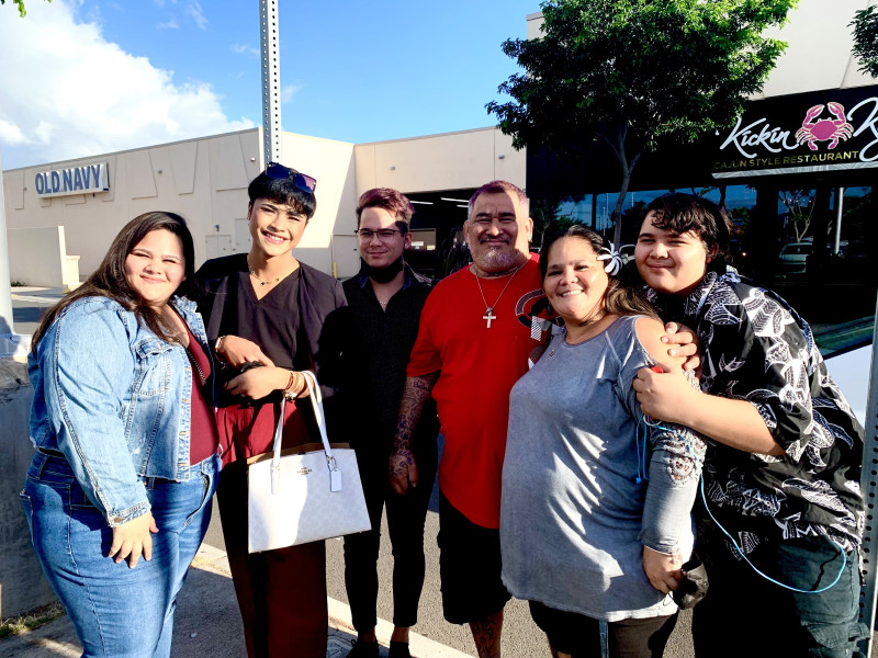 This is a photo of my daughter Cady, son in law Kaulana, son Cody, my husband Michael, myself and son Nos