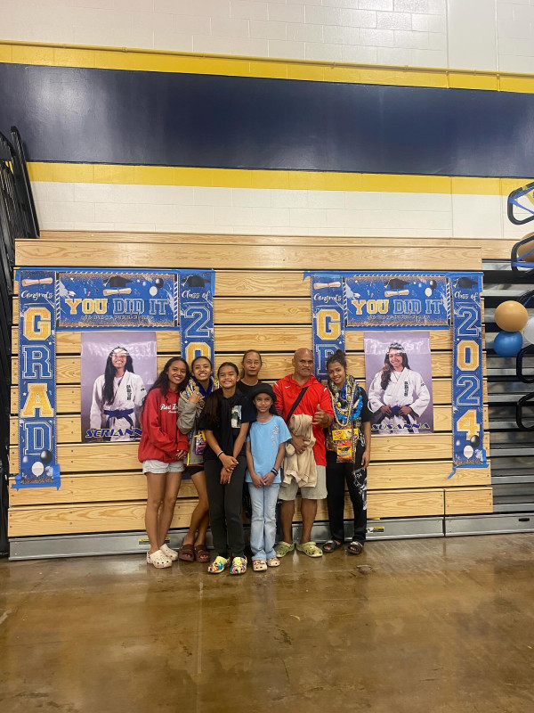 This is a picture of my family at senior night for judo