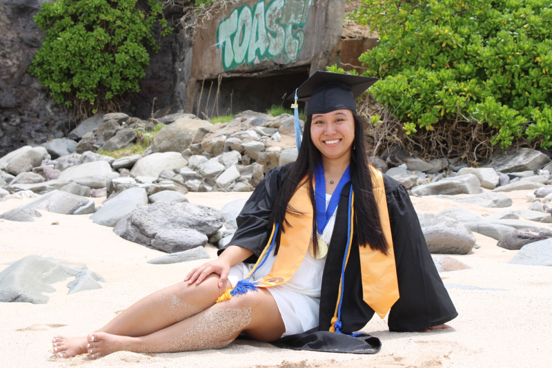 Christina Jean Tadeo in her cap & gown and Phi Theta Kappa regalia