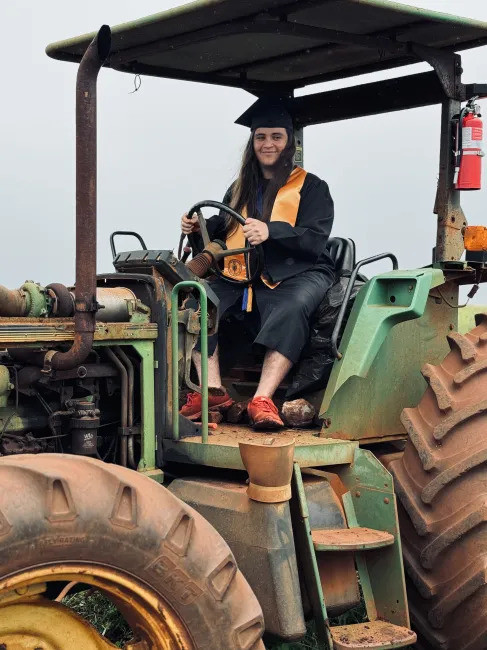 Here I am with the work tractor in Waiawa. This is the at Ho Farms where I work.