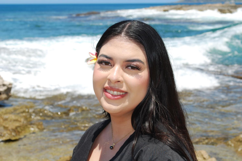 dressed in my gown with the background being the ocean