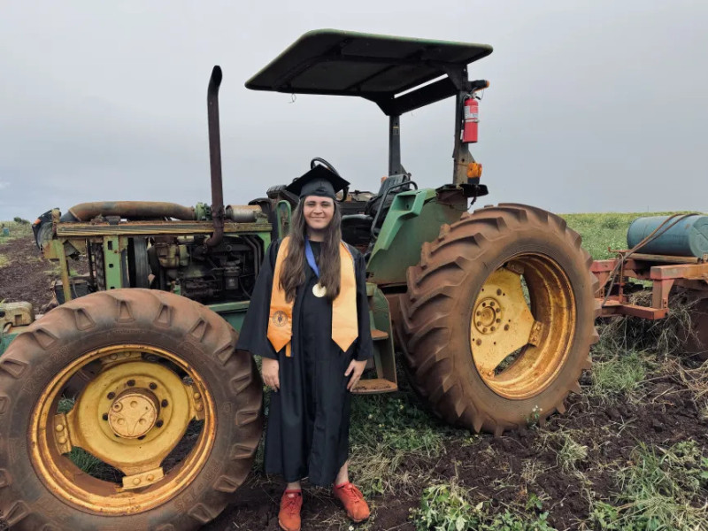 Here I am with the work tractor in Waiawa. This is the at Ho Farms where I work.