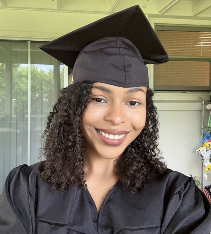 Picture of me in graduation gown and cap.